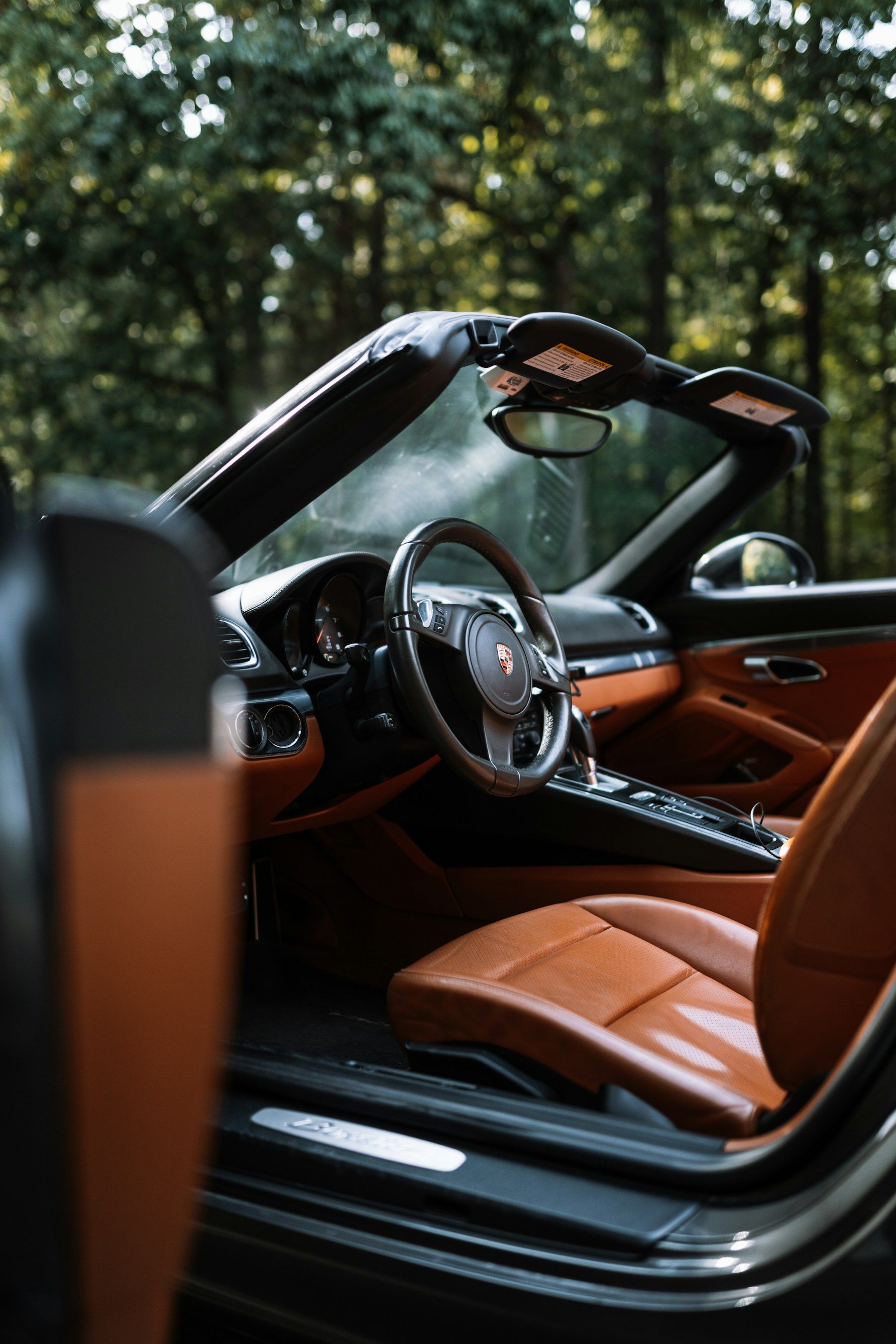 Tan leather interior of a convertible sports car